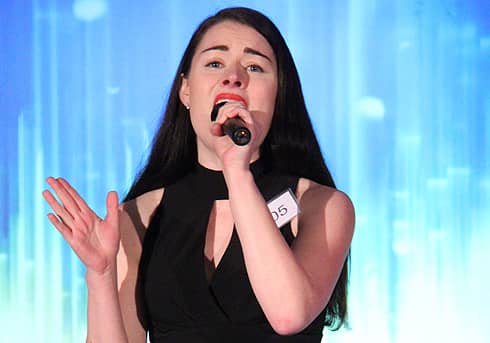 performer singing on stage